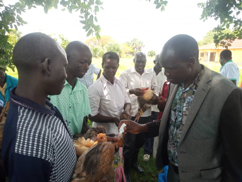 Mr Emmy Ojirot, the deputy resident district commissioner launching the paultry vaccination program on Tuesday 