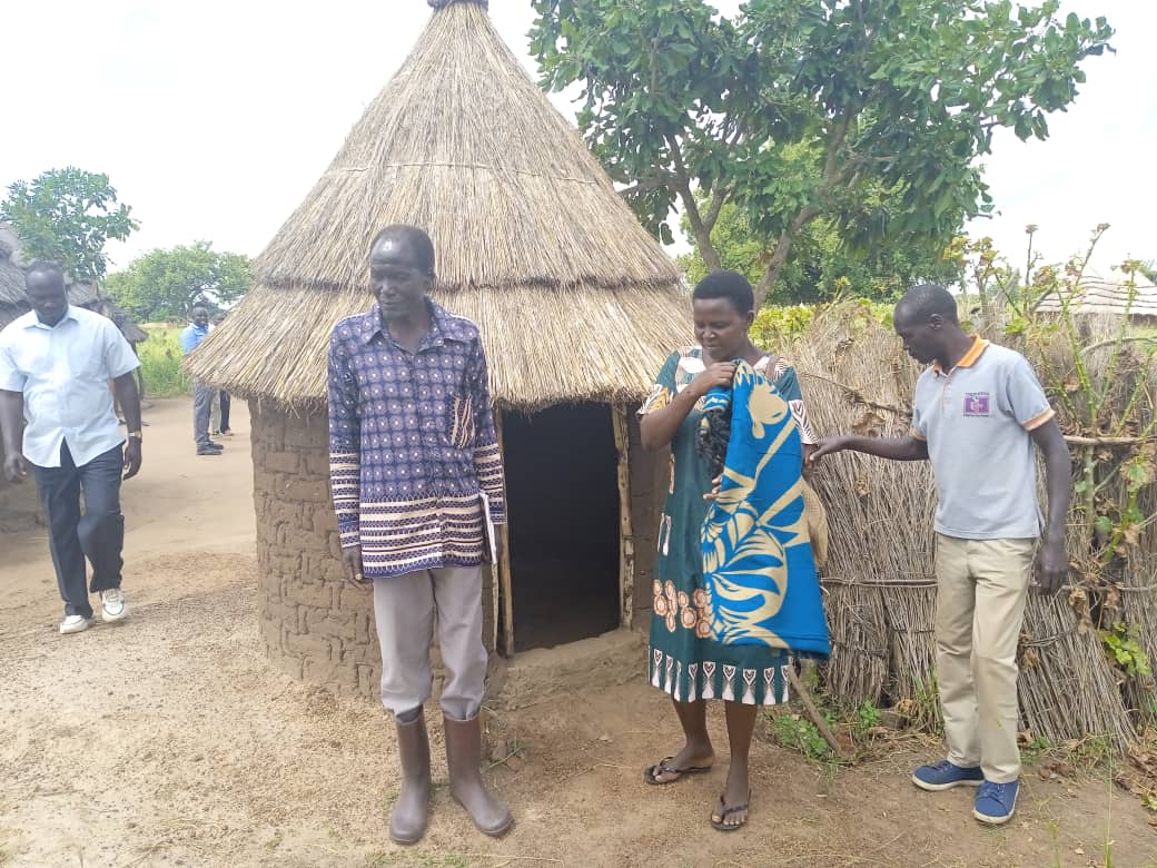 Miria Atia, the vice District Chairperson of Kapelebyong monitoring the state of sanitation of households in the district recently. Photo by Emmanuel Opio.jpg 