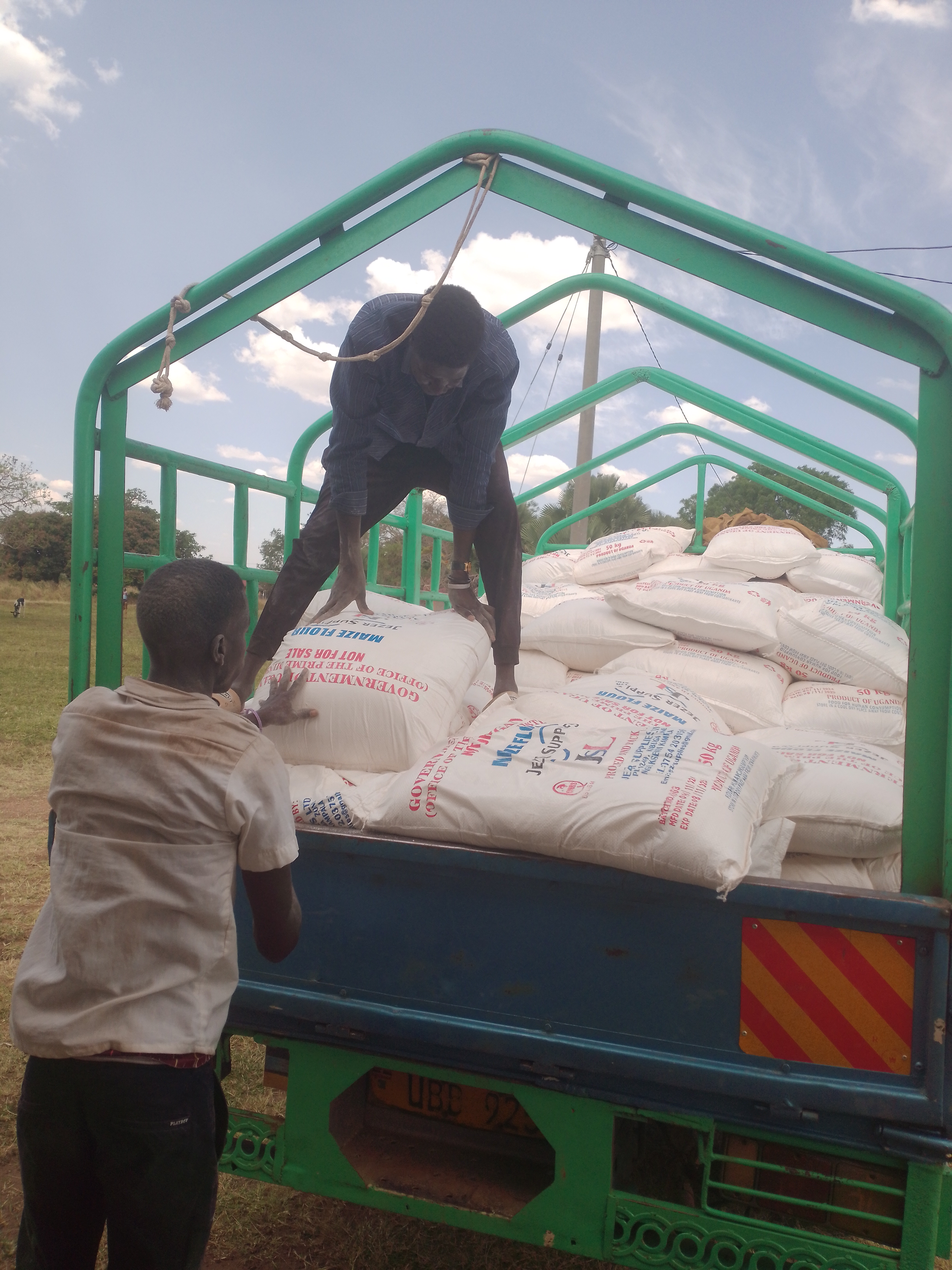 The food relief being loaded on trucks for transportation to the sub counties in Kapelebyong TC on Friday. Photo by Emmanuel Opio