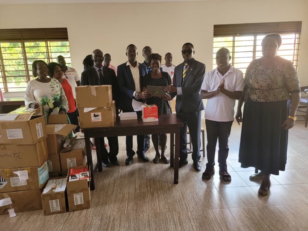 The Ass RDC, Esele Julius (on tie) officiating the distribution of tablets to selected staff last week. Photo by Emmanuel Opio The Ass RDC, Esele Julius (on tie) officiating the distribution of tablets to selected staff last week. Photo by Emmanuel Opio